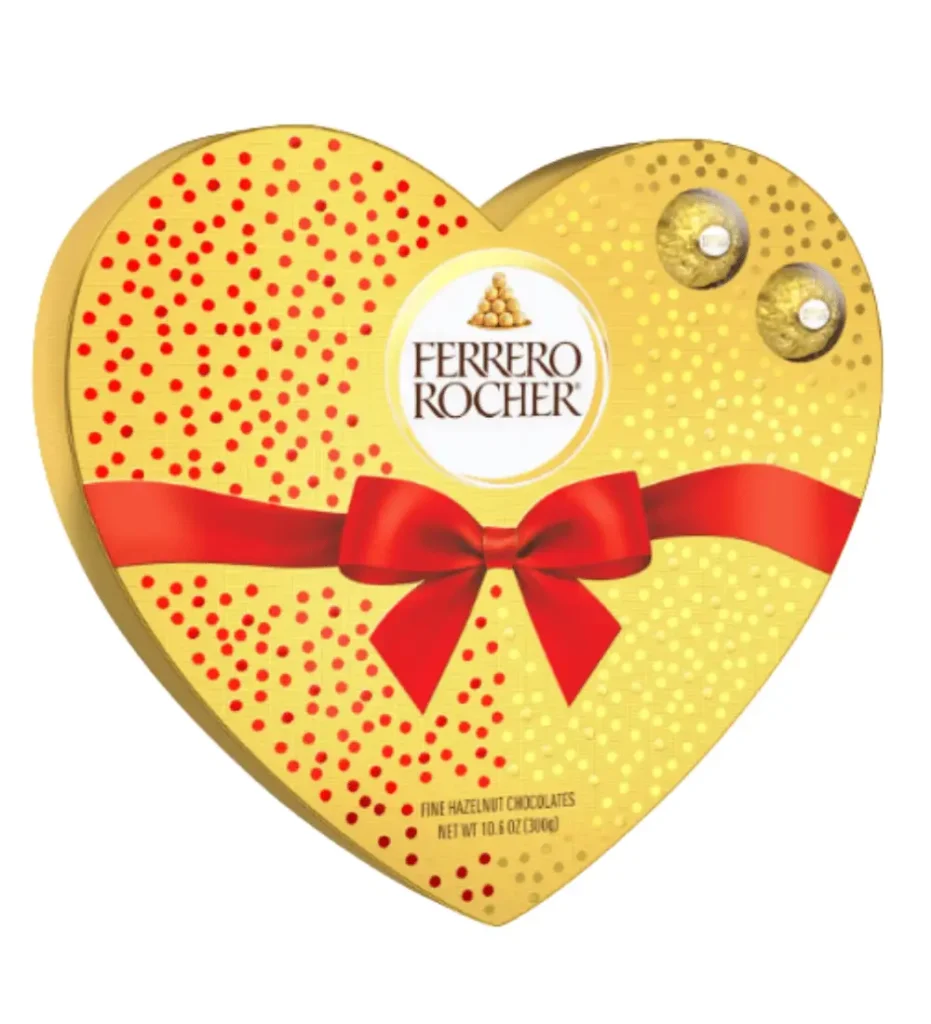 Gold heart-shaped Ferrero Rocher gift box with red ribbon and hazelnut chocolates, a classic indulgent treat upgraded for Valentine's Day gifting.