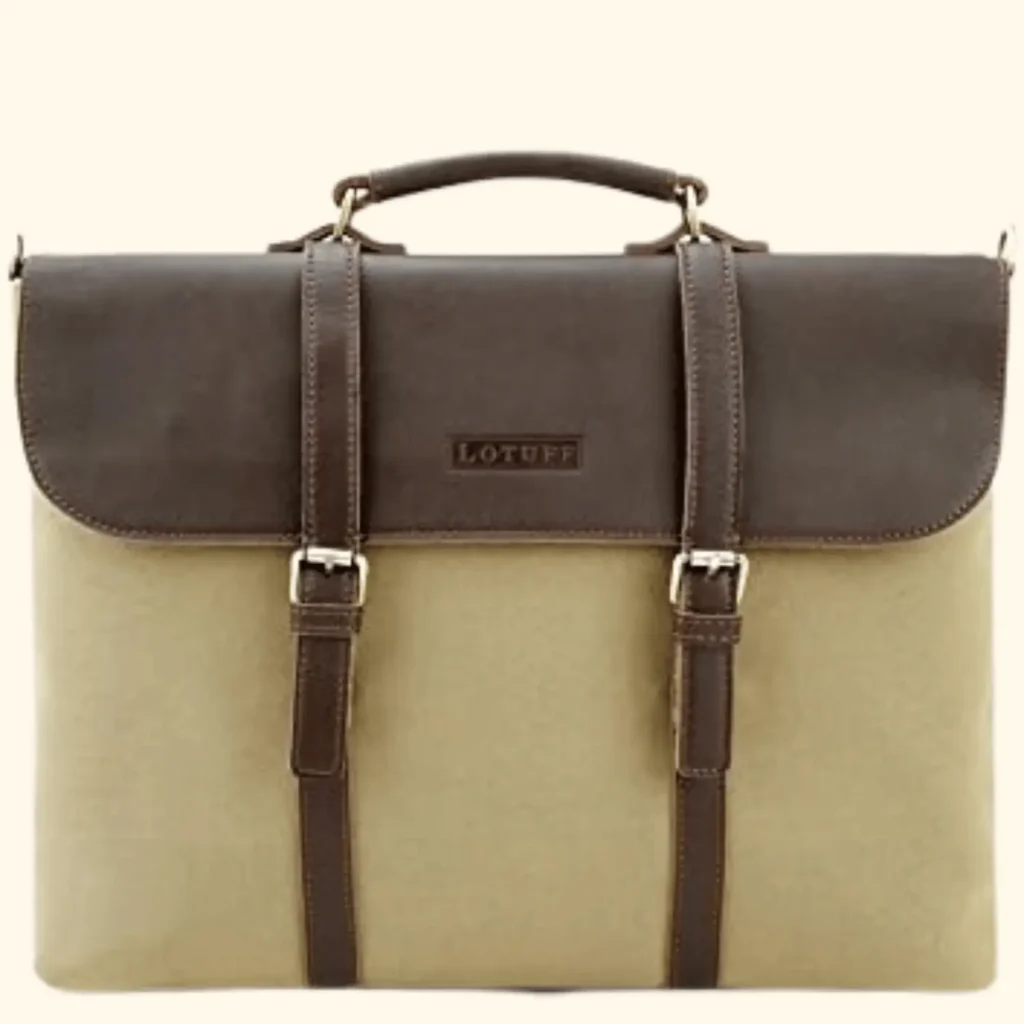A front-facing product shot of a Lotuff leather briefcase, featuring a two-tone design with a dark brown leather top flap and a tan canvas or light leather body. The bag includes a sturdy top handle and two vertical leather straps with brass buckles that secure the flap, which is embossed with the "LOTUFF" brand name.