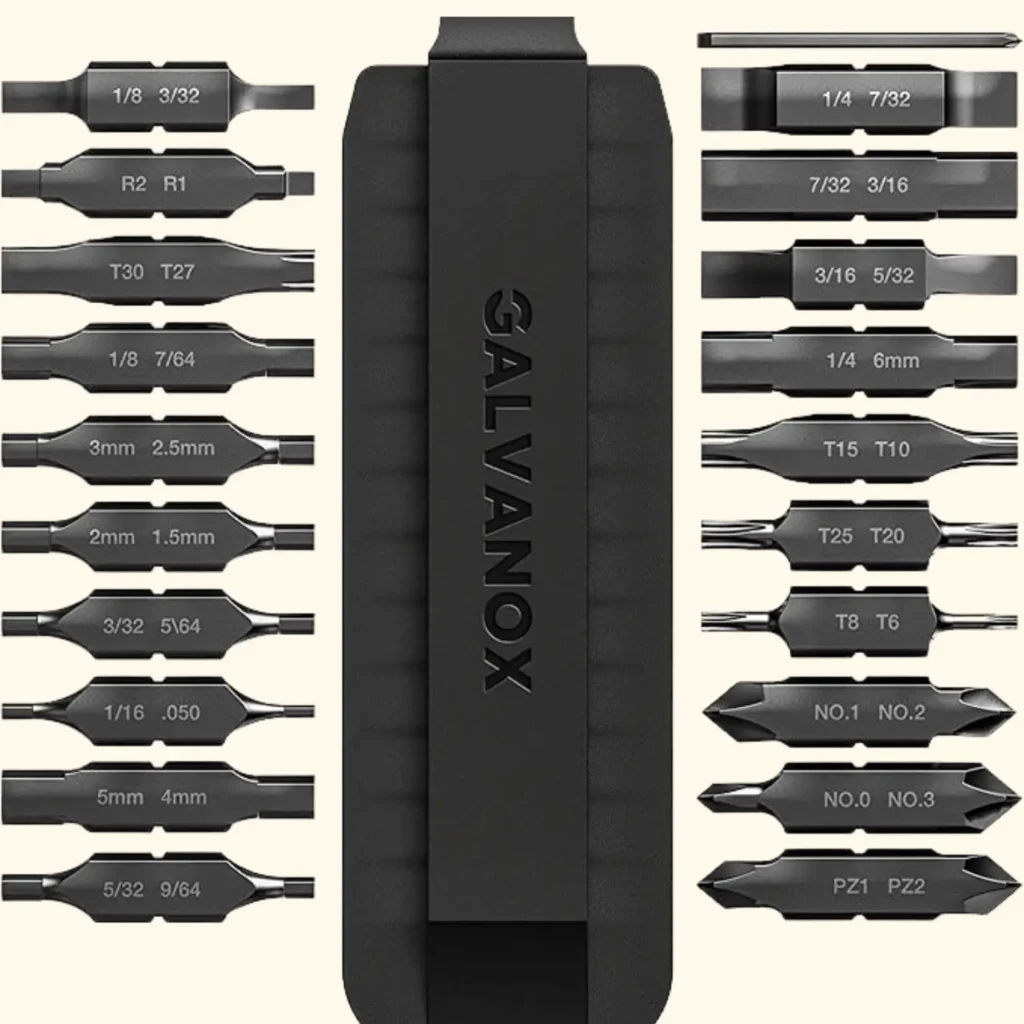 An image of a Galvanox bit kit featuring a central black storage case and twenty-two double-sided replacement bits for a multitool. The bits are arranged in two columns, displaying various sizes and types, including Torx (T6 to T30), Phillips (No. 0 to No. 3), Hex, and Slotted drivers.