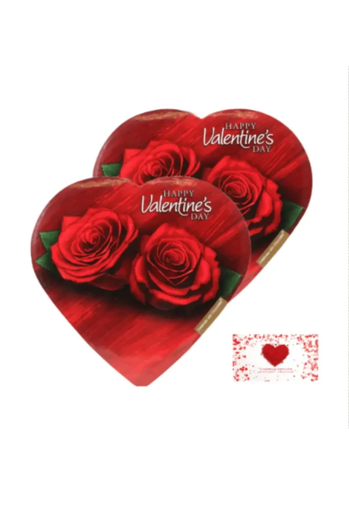 Two heart-shaped Valentine's Day chocolate tins featuring red roses and "Happy Valentine's Day" text, with a matching red heart greeting card – perfect romantic gift idea