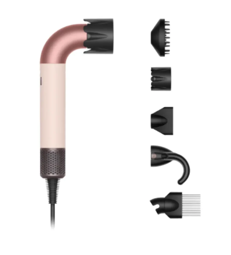 Dyson Supersonic r hair dryer in ceramic pink and rose gold curved design, displayed with multiple styling attachments including diffuser, concentrator, and flyaway tool, a premium trending Valentine's Day gift for 2026.